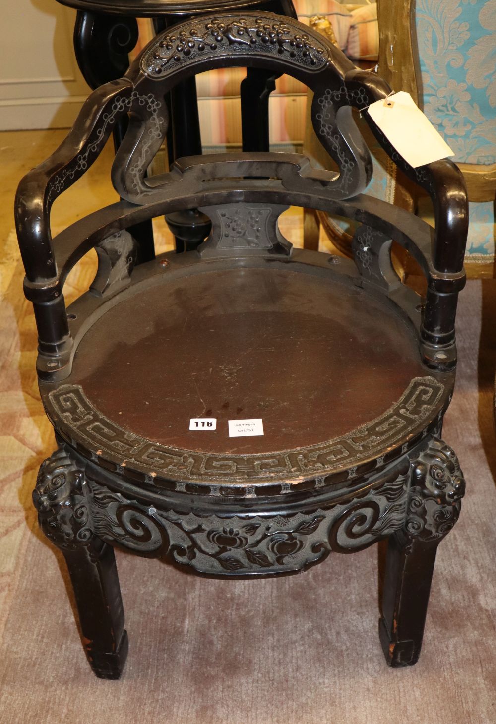 A Chinese carved hardwood tub framed chair, with circular seat, W.55cm, H.82cm